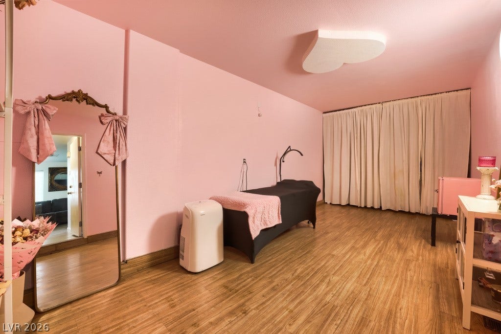 2099 Lost Maple Street, Las Vegas, NV 89115 Warm wood flooring grounds this versatile room with generous proportions.
