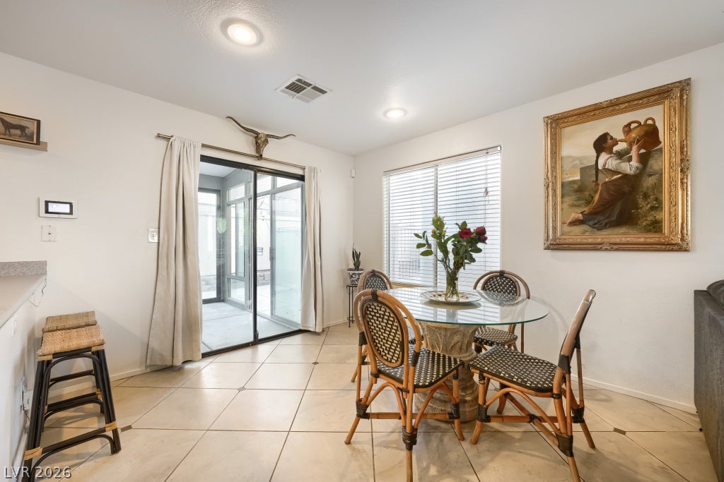 2099 Lost Maple Street, Las Vegas, NV 89115 Tile flooring and sliding glass doors create a seamless transition to the outdoors.