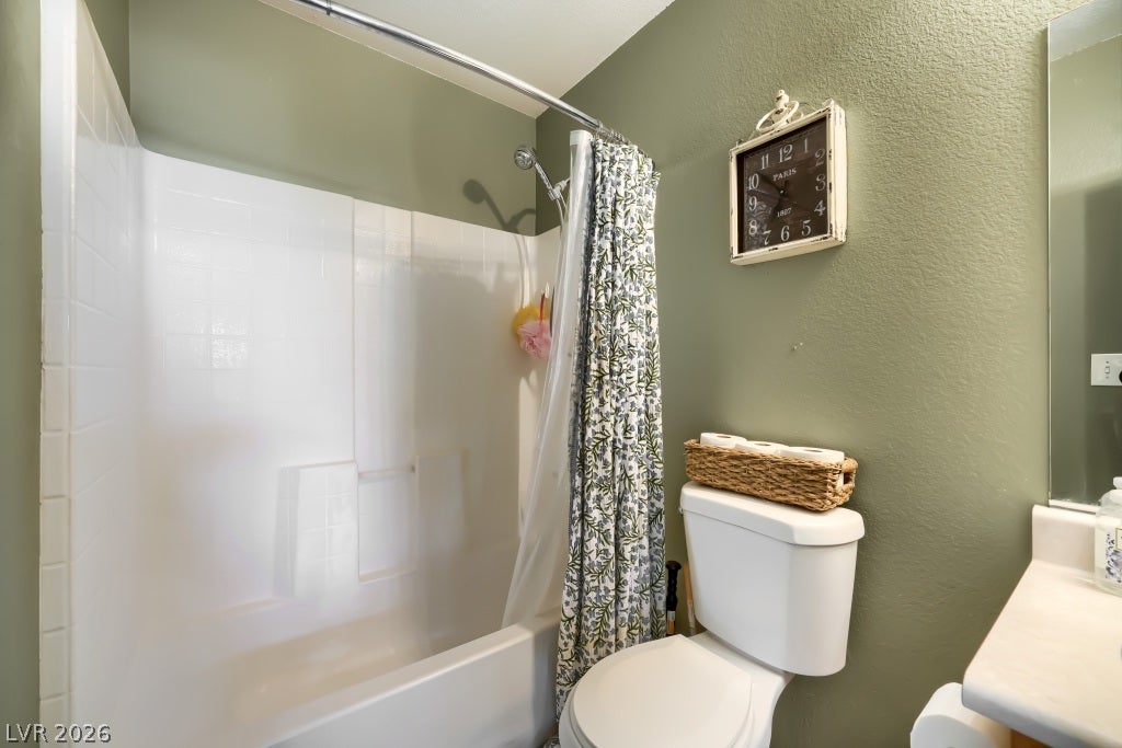 2099 Lost Maple Street, Las Vegas, NV 89115 A classic shower and tub combination anchors this functional bathroom space.