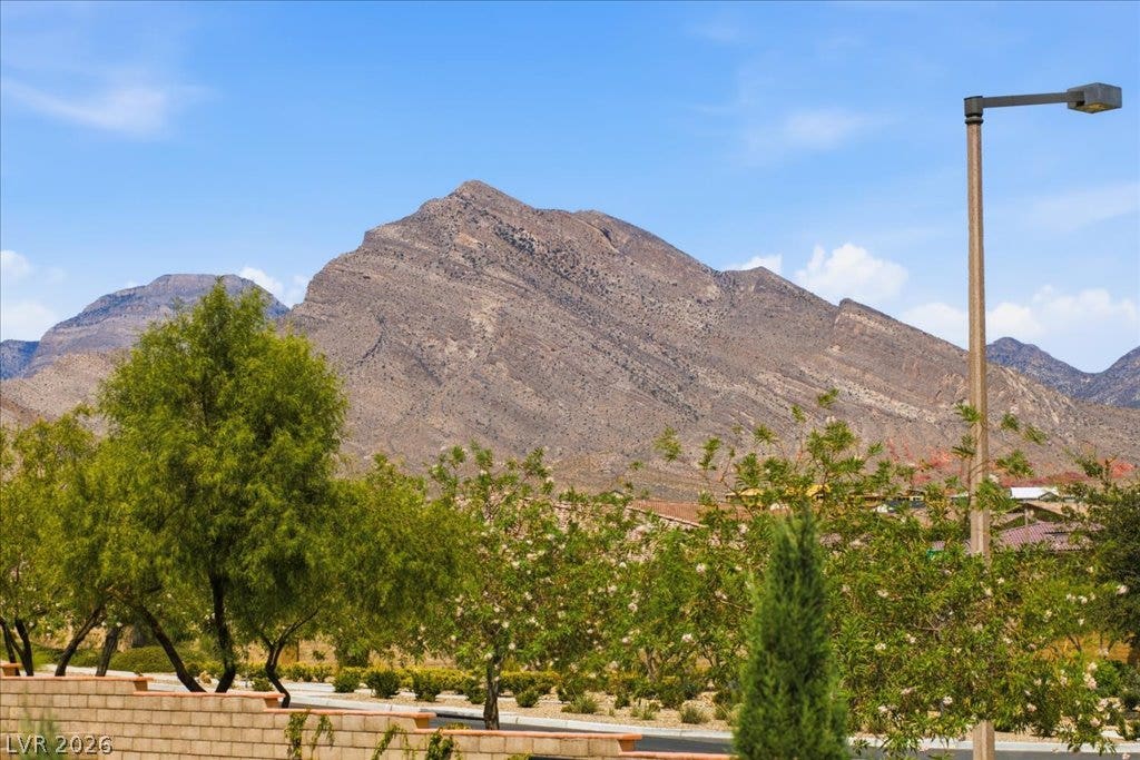 181 Elder View Drive, Las Vegas, NV 89138 Dramatic mountain vistas rise above the surrounding neighborhood trees.