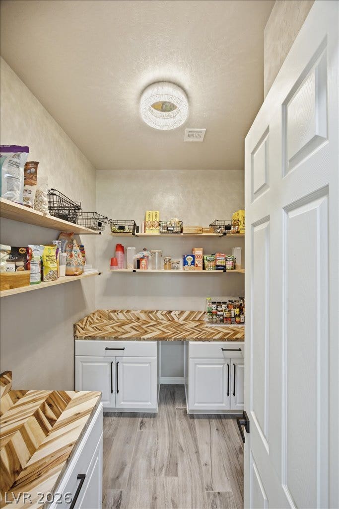 181 Elder View Drive, Las Vegas, NV 89138 A walk-in pantry provides generous storage space with built-in cabinetry and durable flooring.