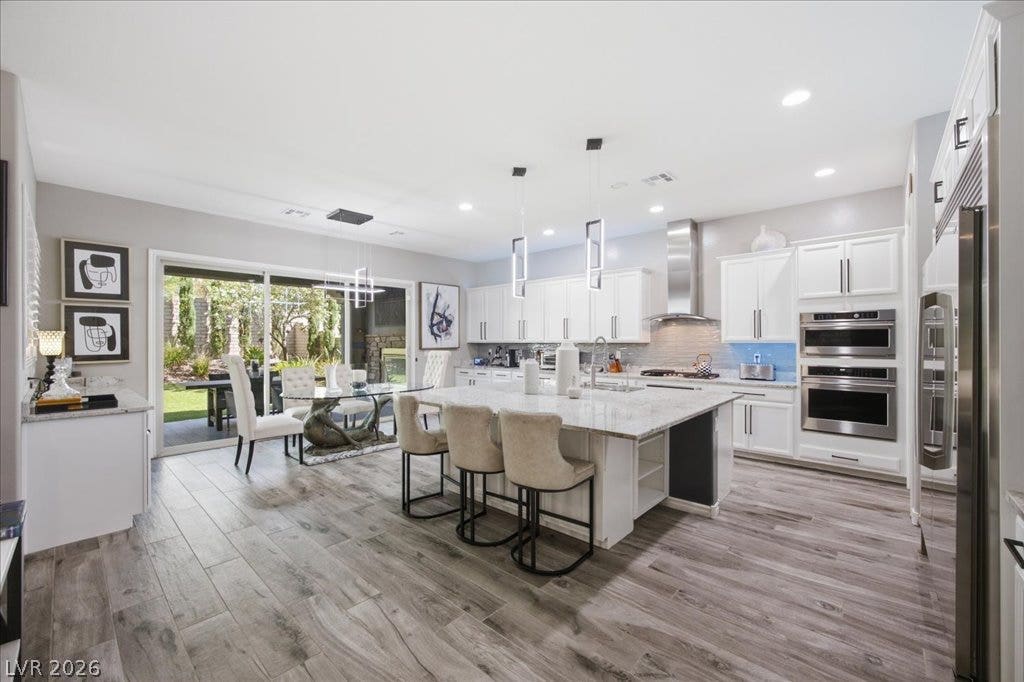 181 Elder View Drive, Las Vegas, NV 89138 Generous open-concept layout connects a gourmet kitchen to the dining area and outdoor patio.