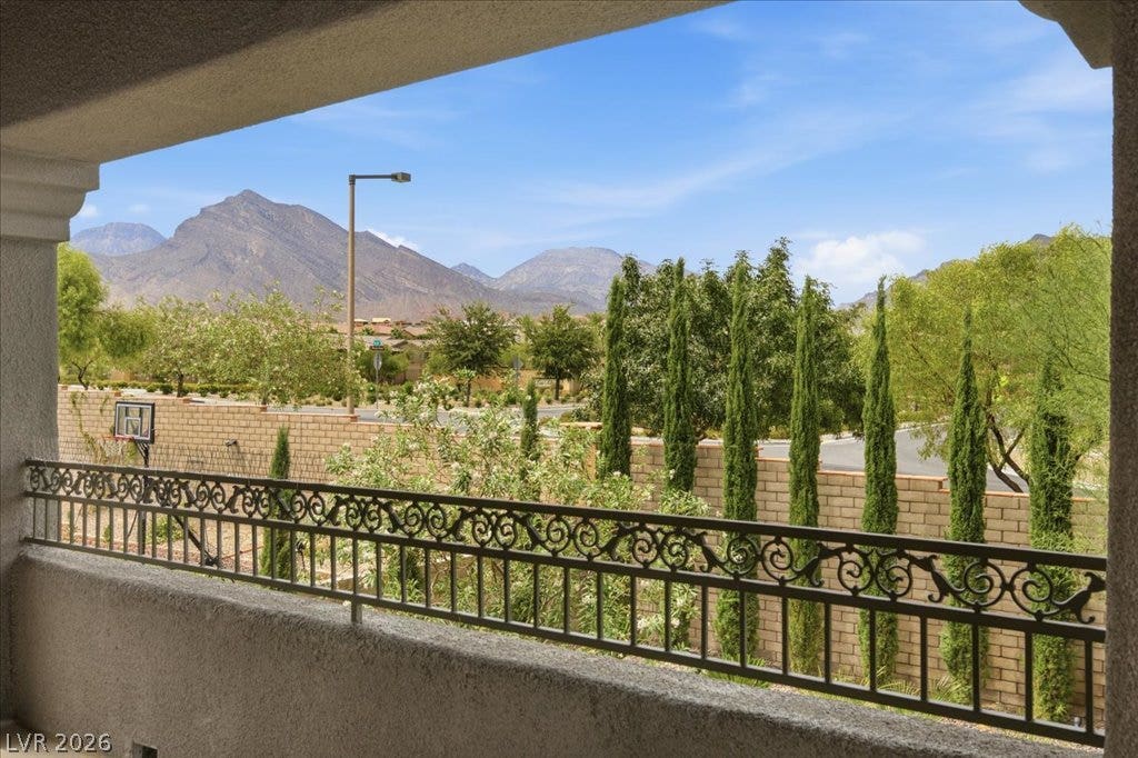 181 Elder View Drive, Las Vegas, NV 89138 A commanding balcony view reveals distant mountains and a serene neighborhood landscape.