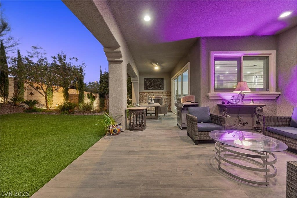 181 Elder View Drive, Las Vegas, NV 89138 An inviting covered patio features smooth tile flooring and seamless access to a manicured lawn.