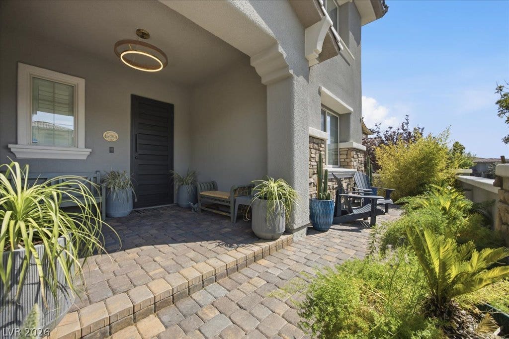 181 Elder View Drive, Las Vegas, NV 89138 Inviting stone pavers and classic architectural pillars frame this elegant entryway design.