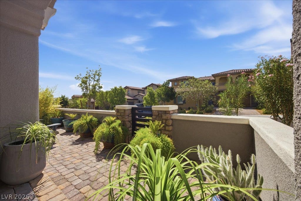 181 Elder View Drive, Las Vegas, NV 89138 A private paved courtyard offers scenic neighborhood views under clear blue skies.
