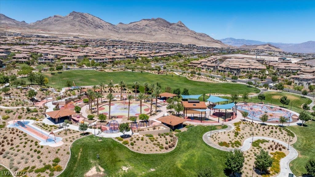 181 Elder View Drive, Las Vegas, NV 89138 An aerial perspective reveals a vibrant community park nestled among residential homes and mountainous terrain.