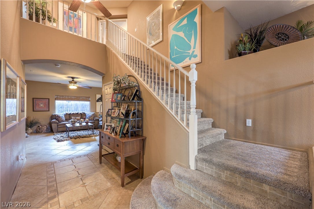 10474 Rustyville Court, Las Vegas, NV 89129 A spacious entry leads to an inviting living area, showcasing the home's thoughtful design and comfortable living.