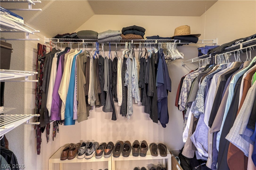 10474 Rustyville Court, Las Vegas, NV 89129 Ample closet space with practical shelving and hanging solutions for organized living.