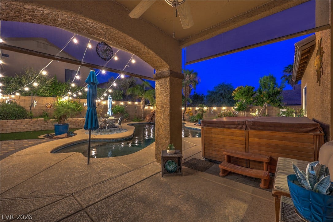 10474 Rustyville Court, Las Vegas, NV 89129 The above ground spa is included. The covered patio also offers roll down shades.