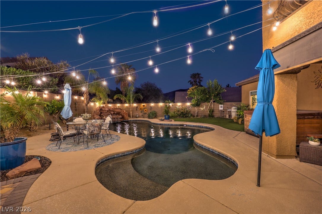 10474 Rustyville Court, Las Vegas, NV 89129 The landscape offers turf in multiple areas and raised plant beds.