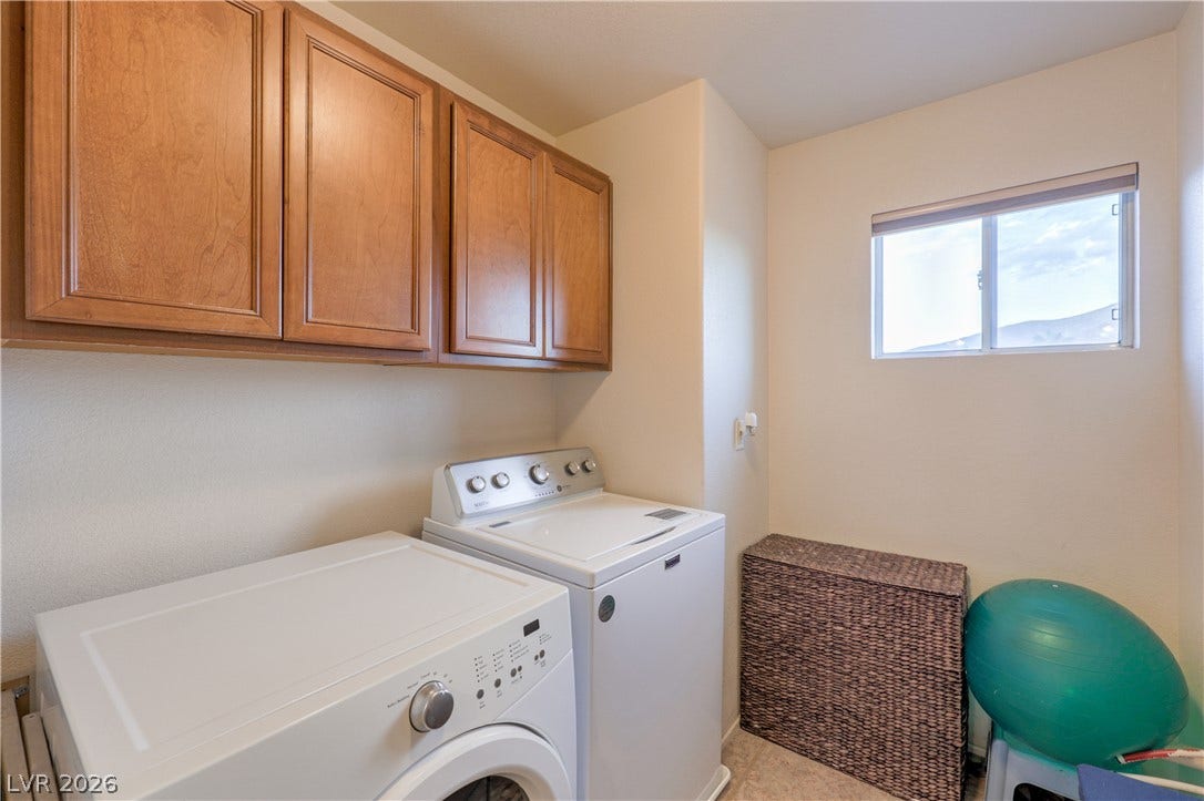 10474 Rustyville Court, Las Vegas, NV 89129 Ample cabinetry provides smart storage in this bright and functional utility room, complete with laundry facilities.