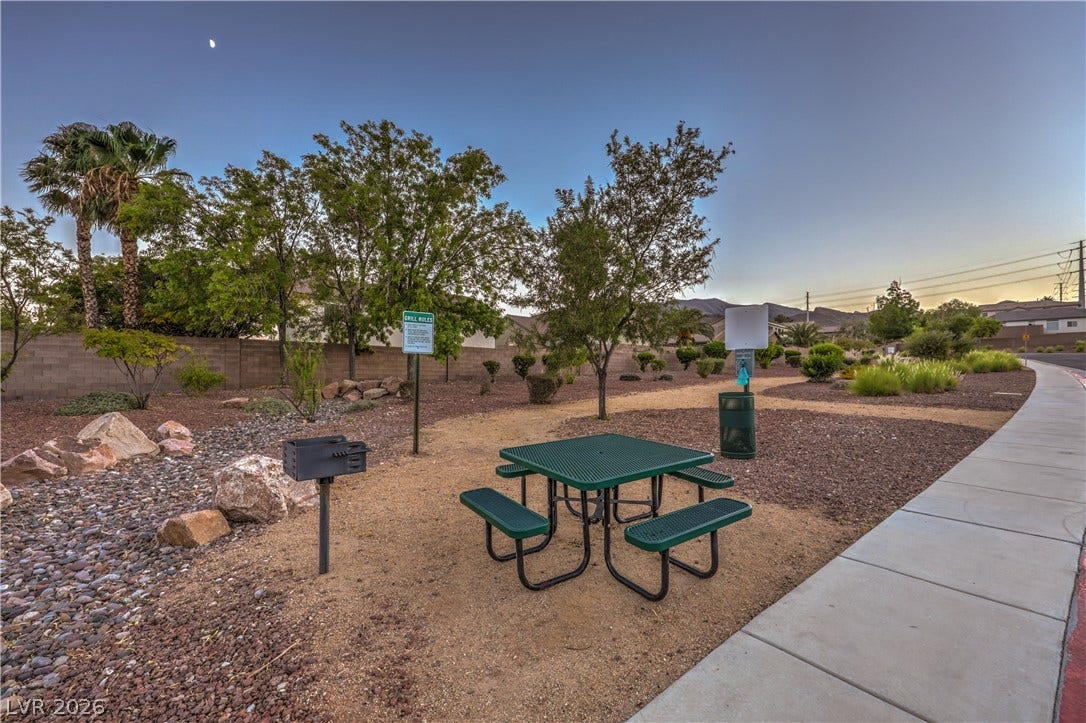 10474 Rustyville Court, Las Vegas, NV 89129 A well-maintained community park offers a picnic area with a barbecue, perfect for outdoor gatherings.