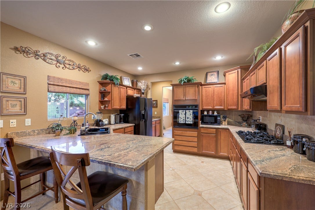 10474 Rustyville Court, Las Vegas, NV 89129 The kitchen offers a lot of counter space for prep and several cooks in the kitchen.
