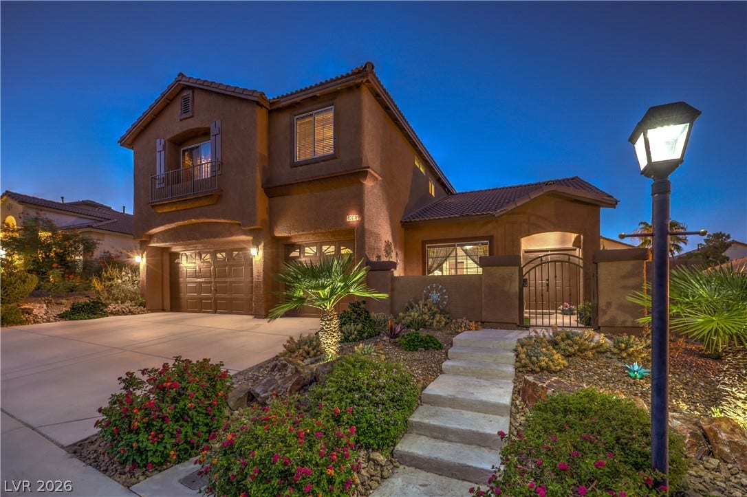 10474 Rustyville Court, Las Vegas, NV 89129 A terracotta-hued residence welcomes with a grand arched entry and 3 are garage.