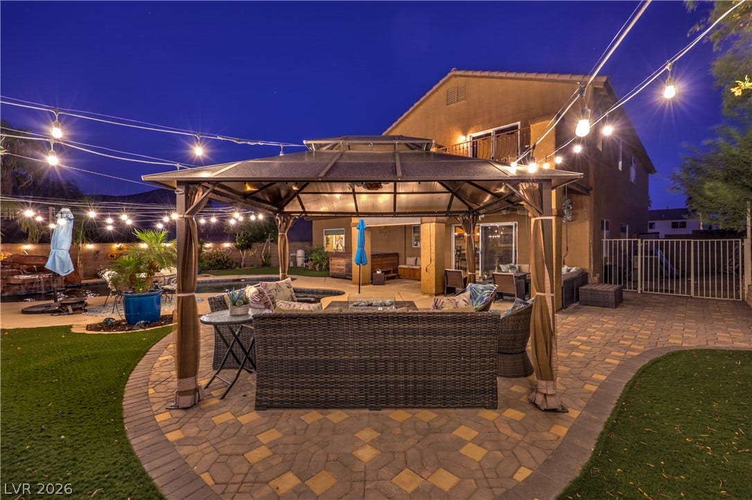 10474 Rustyville Court, Las Vegas, NV 89129 This yard is oversized and offers separate spaces to relax and entertain.