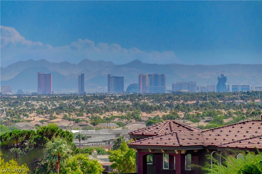 Sweeping mountain and skyline panoramas frame this elevated neighborhood perspective.