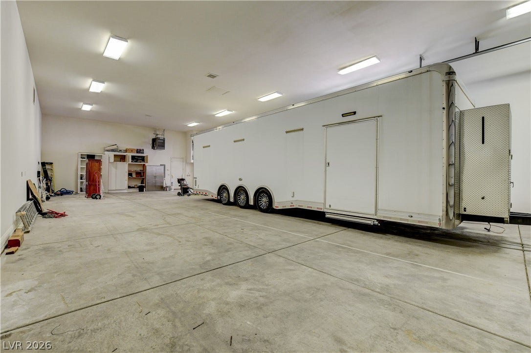 An oversized concrete floor provides abundant room for large vehicle storage and workshops.