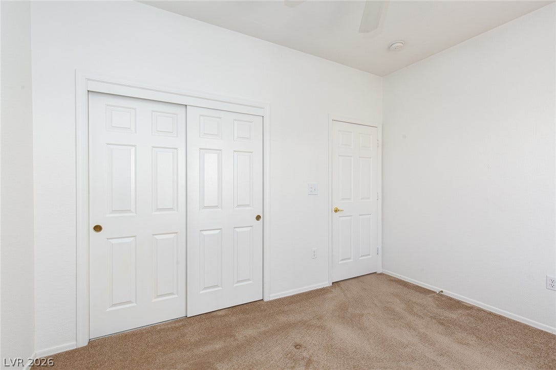 10725 Windledge Avenue, Las Vegas, NV 89134 Six-panel doors and neutral carpeting create a clean, versatile interior canvas.