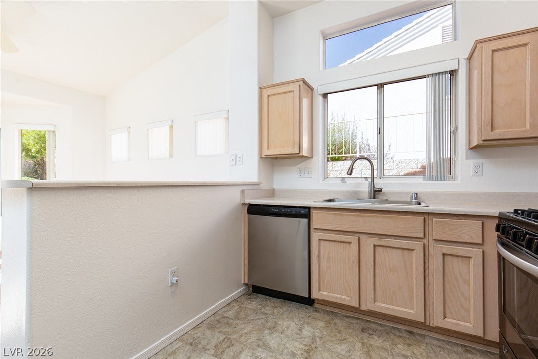 10725 Windledge Avenue, Las Vegas, NV 89134 Natural light streams through high windows in this open-concept kitchen.