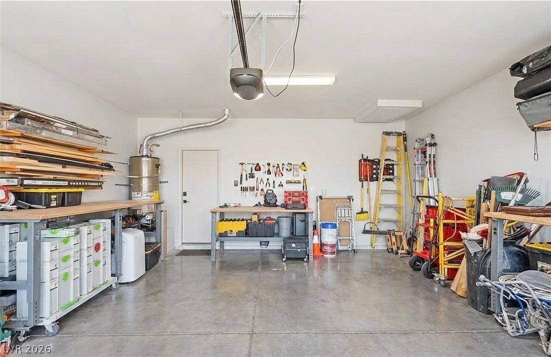 6163 Bayard Street, Las Vegas, NV 89148 A spacious and organized garage features polished concrete floors and high ceilings.