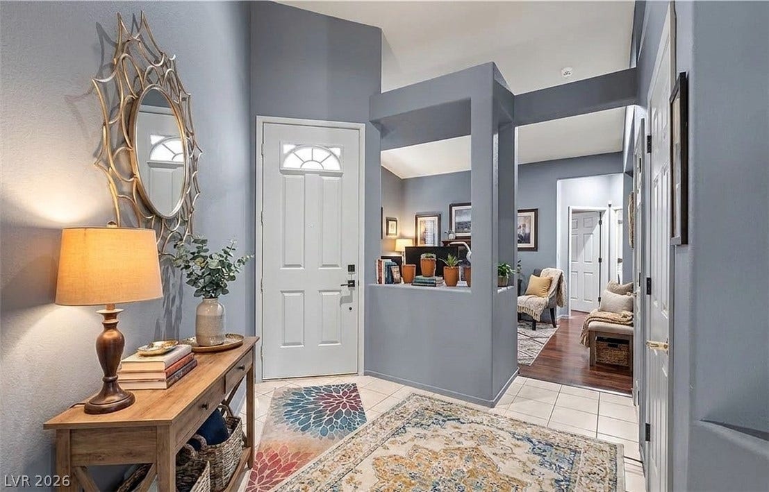 6163 Bayard Street, Las Vegas, NV 89148 High ceilings and tiled flooring welcome guests into a spacious entry foyer with architectural cutouts.