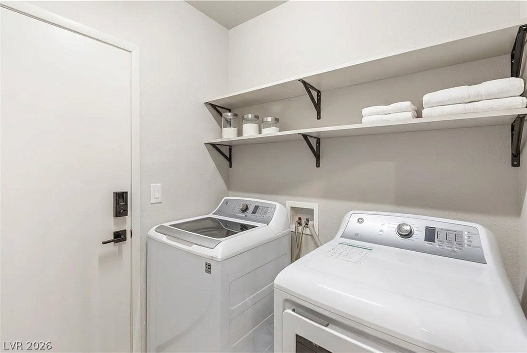 6163 Bayard Street, Las Vegas, NV 89148 Functional laundry space features sturdy open shelving installed directly above the appliances.