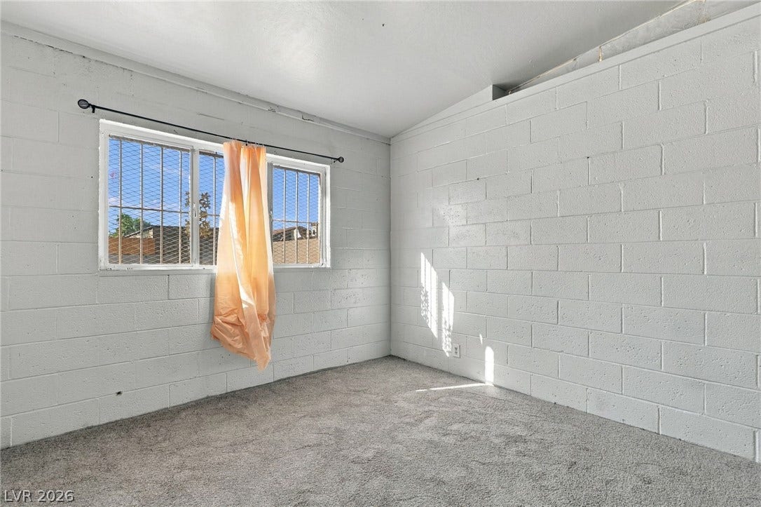 2521 Perliter Avenue, North Las Vegas, NV 89030 Concrete block walls and wall-to-wall carpeting define this versatile basement space.