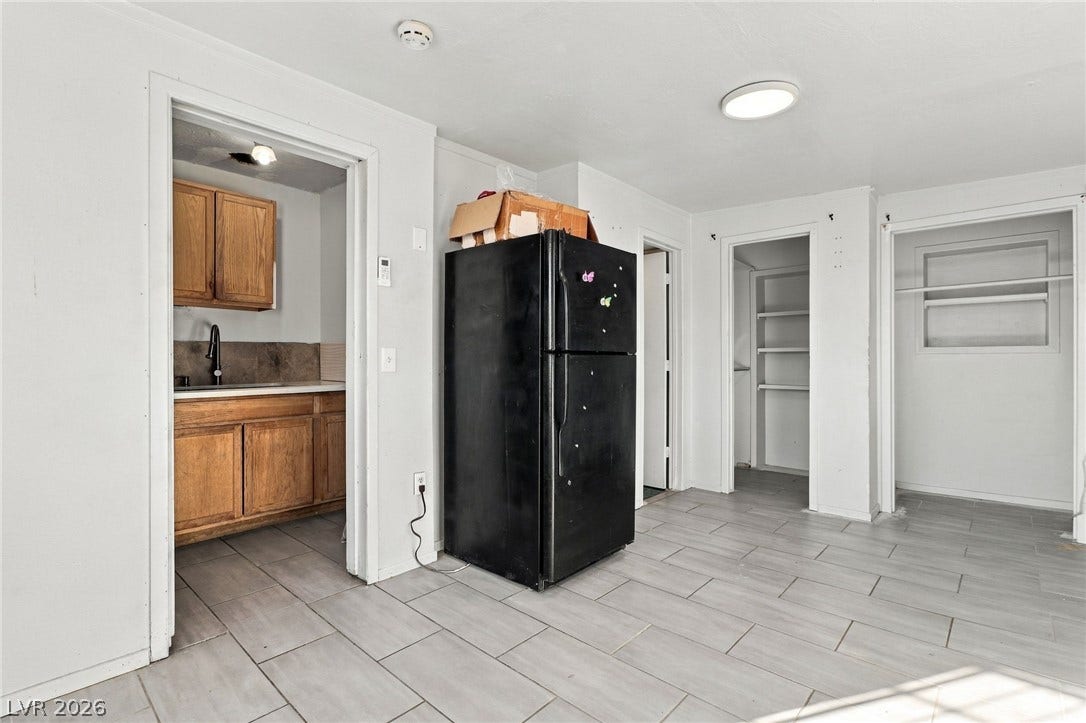 2521 Perliter Avenue, North Las Vegas, NV 89030 Tiled flooring flows through this functional interior space with immediate kitchen access.