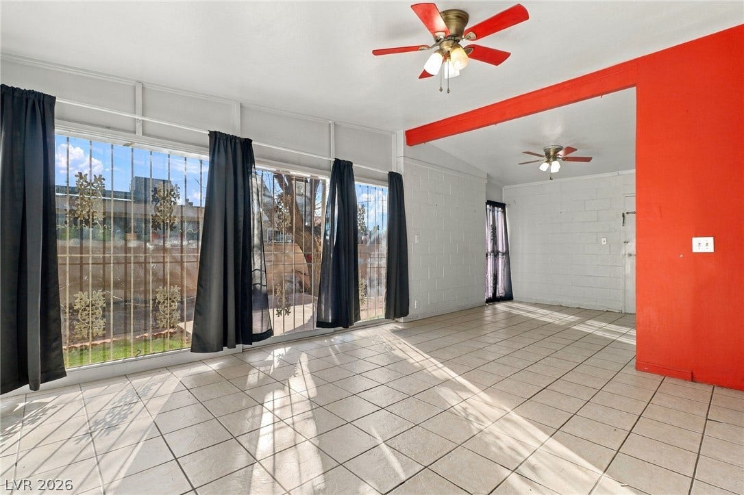 2521 Perliter Avenue, North Las Vegas, NV 89030 Ceramic tile flooring and abundant natural light define this versatile, open living area.