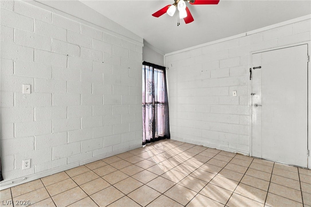2521 Perliter Avenue, North Las Vegas, NV 89030 Tiled flooring and masonry block walls define this functional space.