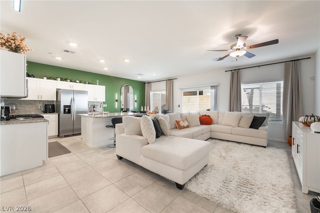 10958 Cheshire Woods Avenue, Las Vegas, NV 89166 An open floorplan seamlessly connects the casual living area to a modern kitchen space.