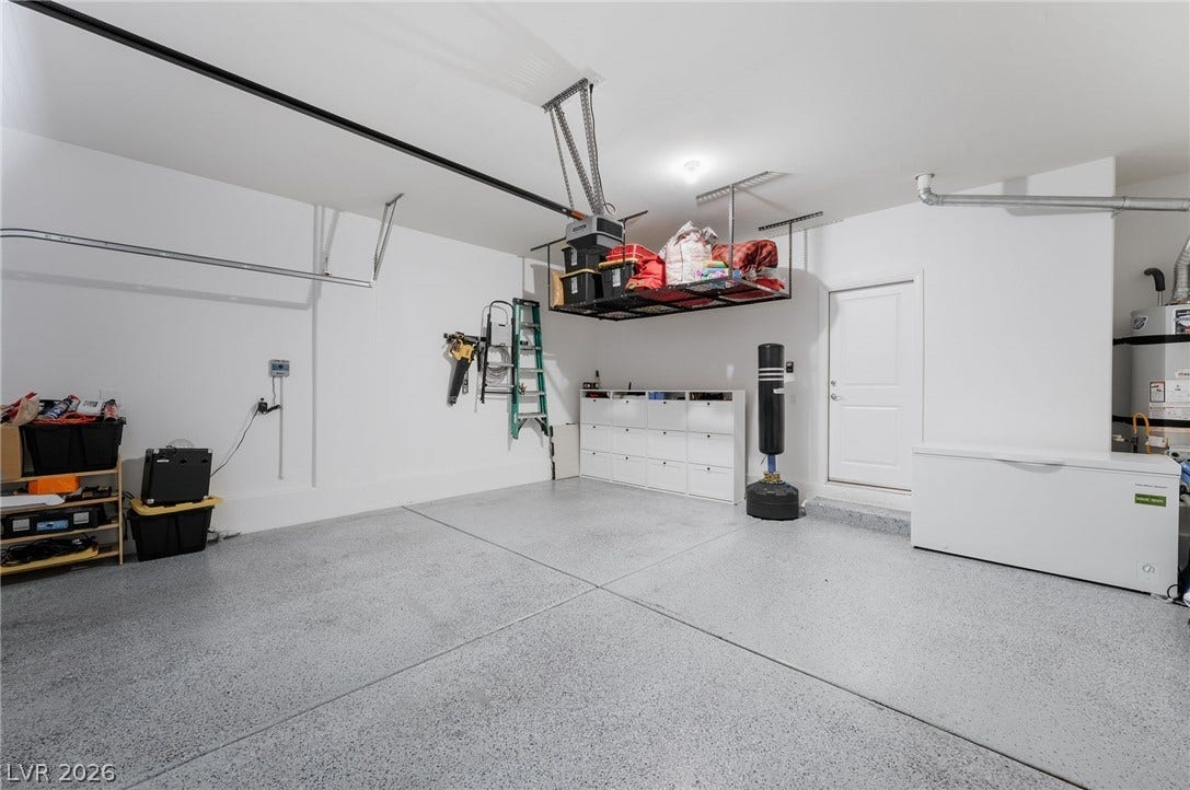 10958 Cheshire Woods Avenue, Las Vegas, NV 89166 Coated concrete floors and high ceilings maximize utility in this spacious garage.