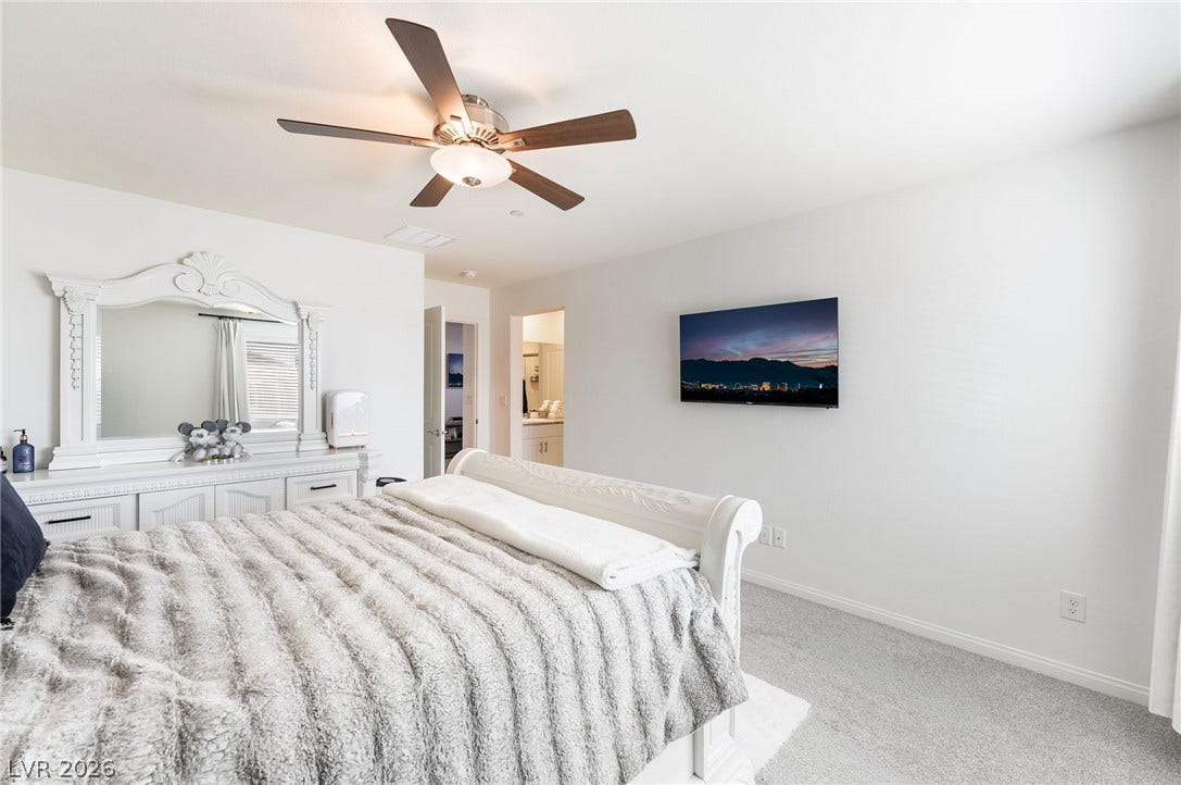 10958 Cheshire Woods Avenue, Las Vegas, NV 89166 Plush wall-to-wall carpeting and clean white walls define this peaceful sleeping space.