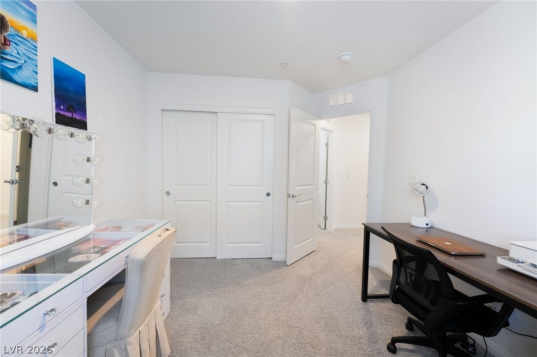 10958 Cheshire Woods Avenue, Las Vegas, NV 89166 Soft carpeting underfoot defines this versatile bedroom complete with a built-in closet.
