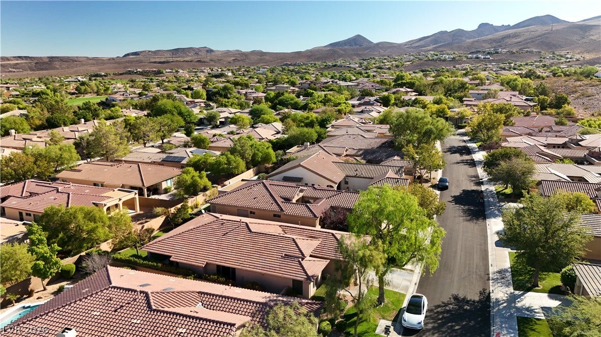 6 Mohansic Road, Henderson, NV 89052 Scenic neighborhood panoramas unfold against a dramatic backdrop of desert mountains.