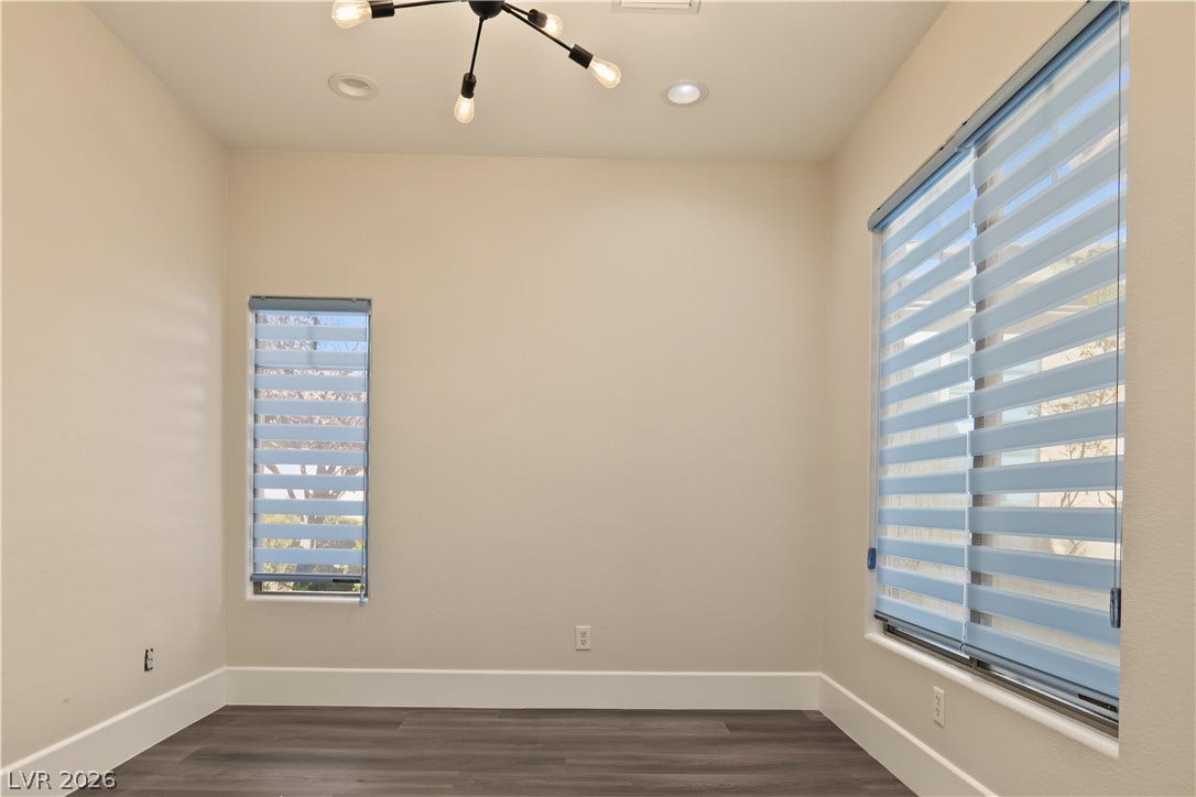 6 Mohansic Road, Henderson, NV 89052 Hardwood floors and tall baseboards anchor this versatile bonus room with dual windows.