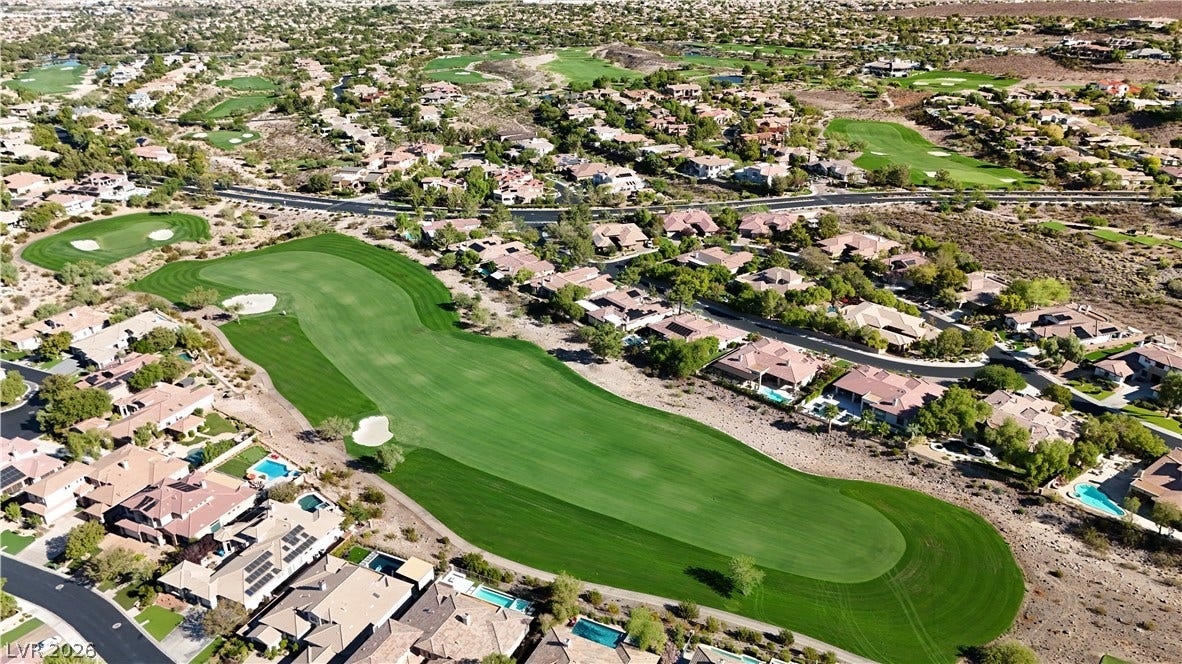 6 Mohansic Road, Henderson, NV 89052 Lush fairways wind through this peaceful desert community, showcasing beautiful golf course views.