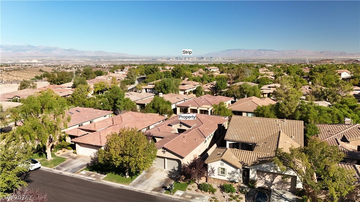6 Mohansic Road, Henderson, NV 89052 Distanced mountains and the city skyline frame this peaceful residential neighborhood.