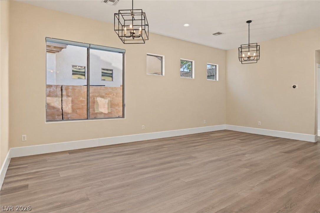 6 Mohansic Road, Henderson, NV 89052 High ceilings and clean wood-plank flooring define this versatile interior space.