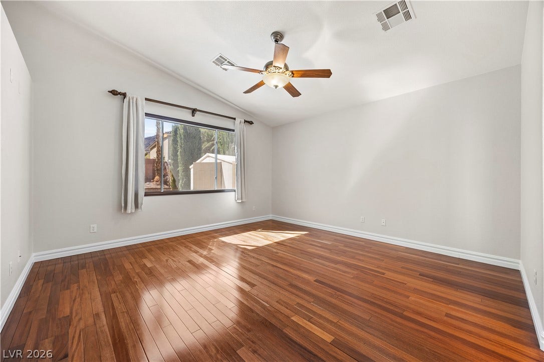 753 Wigan Pier Drive, Henderson, NV 89002 Rich hardwood flooring reflects natural light streaming through the large window.