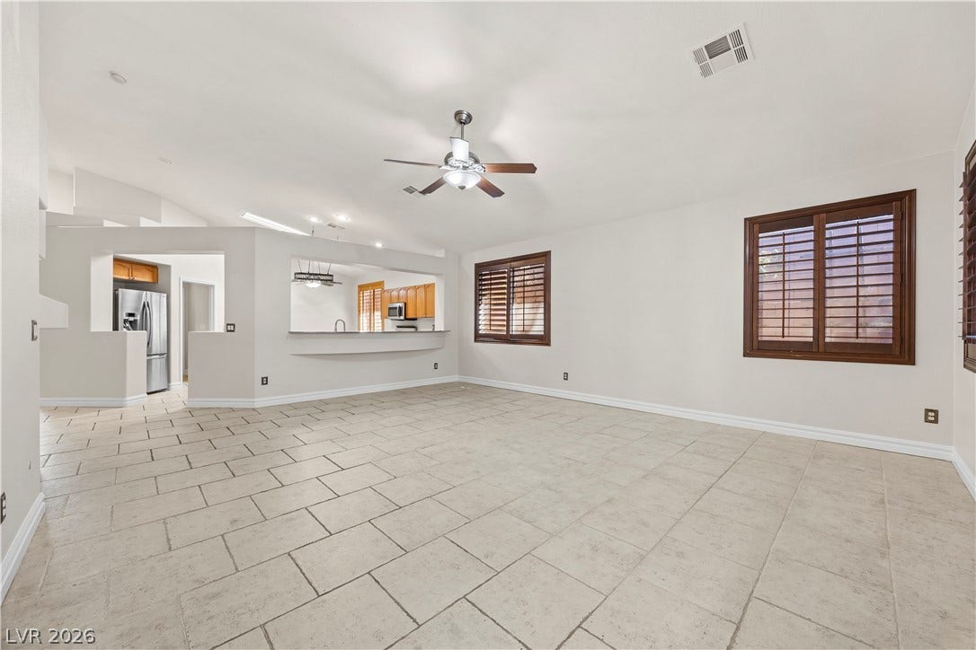 753 Wigan Pier Drive, Henderson, NV 89002 Tile flooring and an open layout connect this living space directly to the kitchen area.