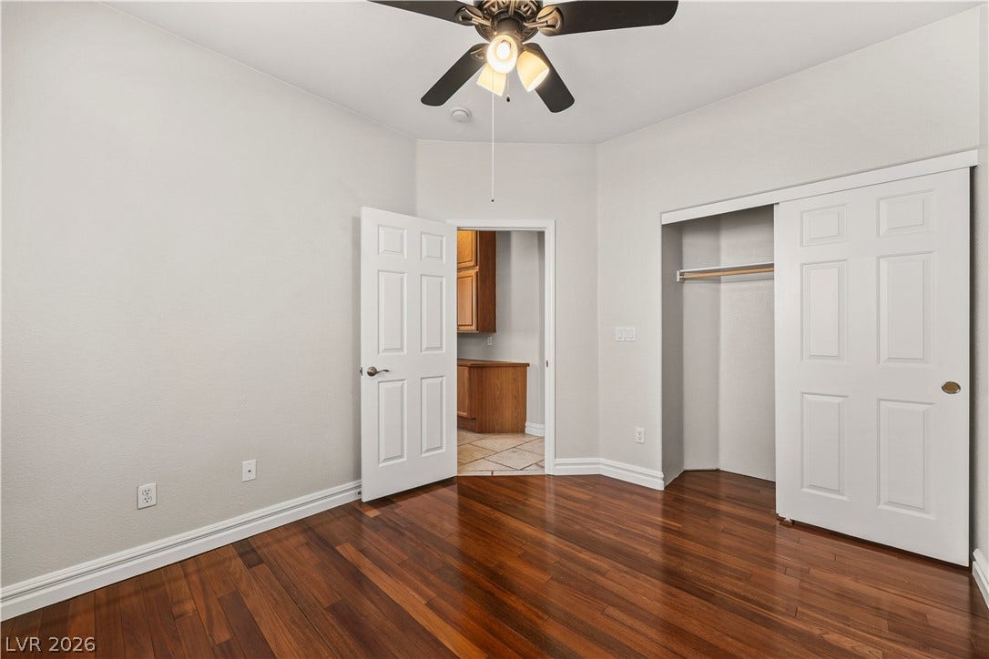 753 Wigan Pier Drive, Henderson, NV 89002 Gleaming hardwood floors and classic molding define this light-filled room with built-in closet storage.