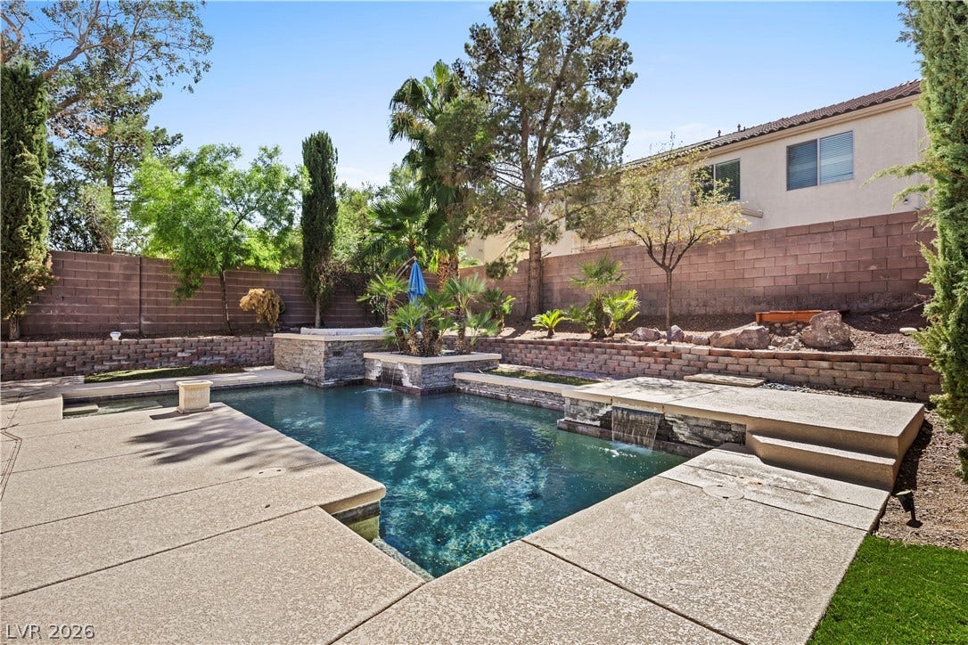 753 Wigan Pier Drive, Henderson, NV 89002 A sparkling swimming pool anchors the backyard retreat framed by privacy walls.