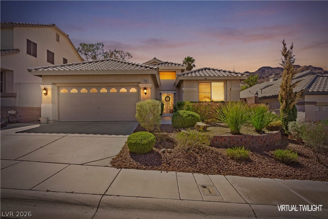 753 Wigan Pier Drive, Henderson, NV 89002 Desert landscaping and a tiled roof enhance the exterior of this single-story home.