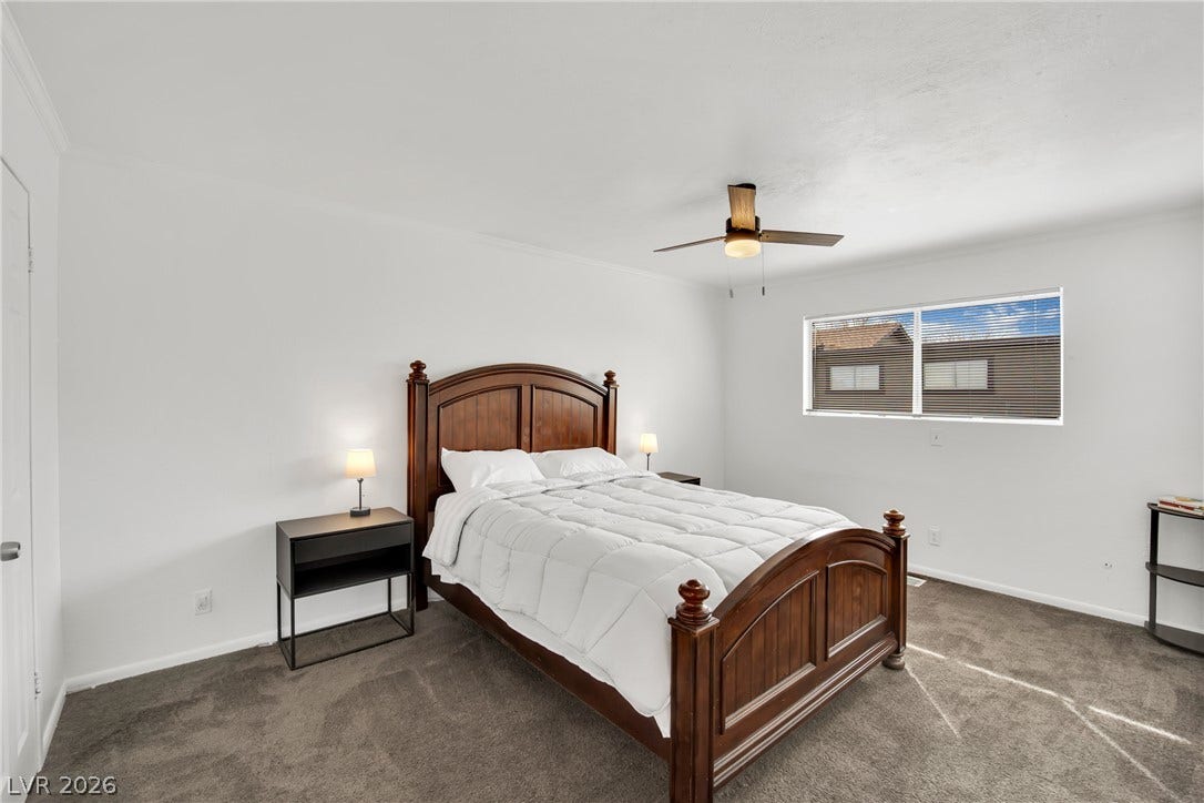 Plush carpeting and crisp white walls define this comfortable second-floor bedroom layout.