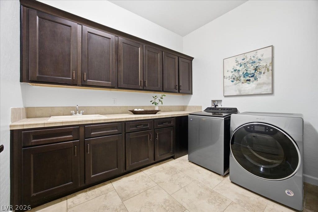 8030 Palm Cove Court, Las Vegas, NV 89129 Ample cabinetry and tile countertops maximize function in this utility space.