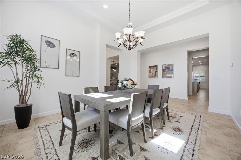 8030 Palm Cove Court, Las Vegas, NV 89129 Gleaming tile floors and a soaring ceiling elevate this elegant formal dining room.