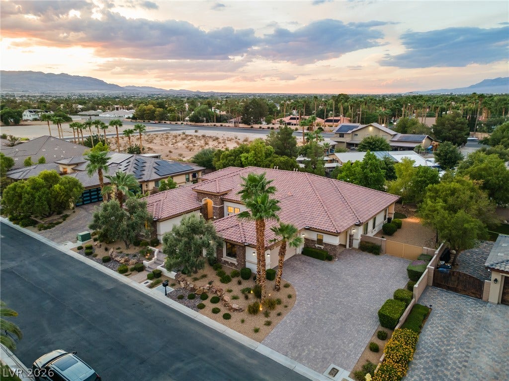 8030 Palm Cove Court, Las Vegas, NV 89129 An elegant tile roof and expansive paver driveway define this classic desert estate.