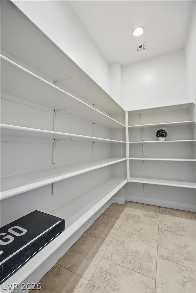 8030 Palm Cove Court, Las Vegas, NV 89129 Ample shelving lines this walk-in storage area adjacent to Butlers Pantry